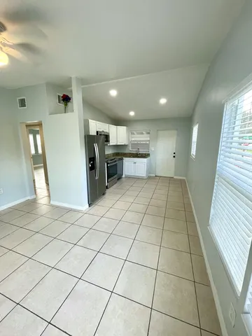 a view of a bathroom with mirror