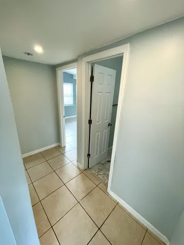 a view of an empty room and window