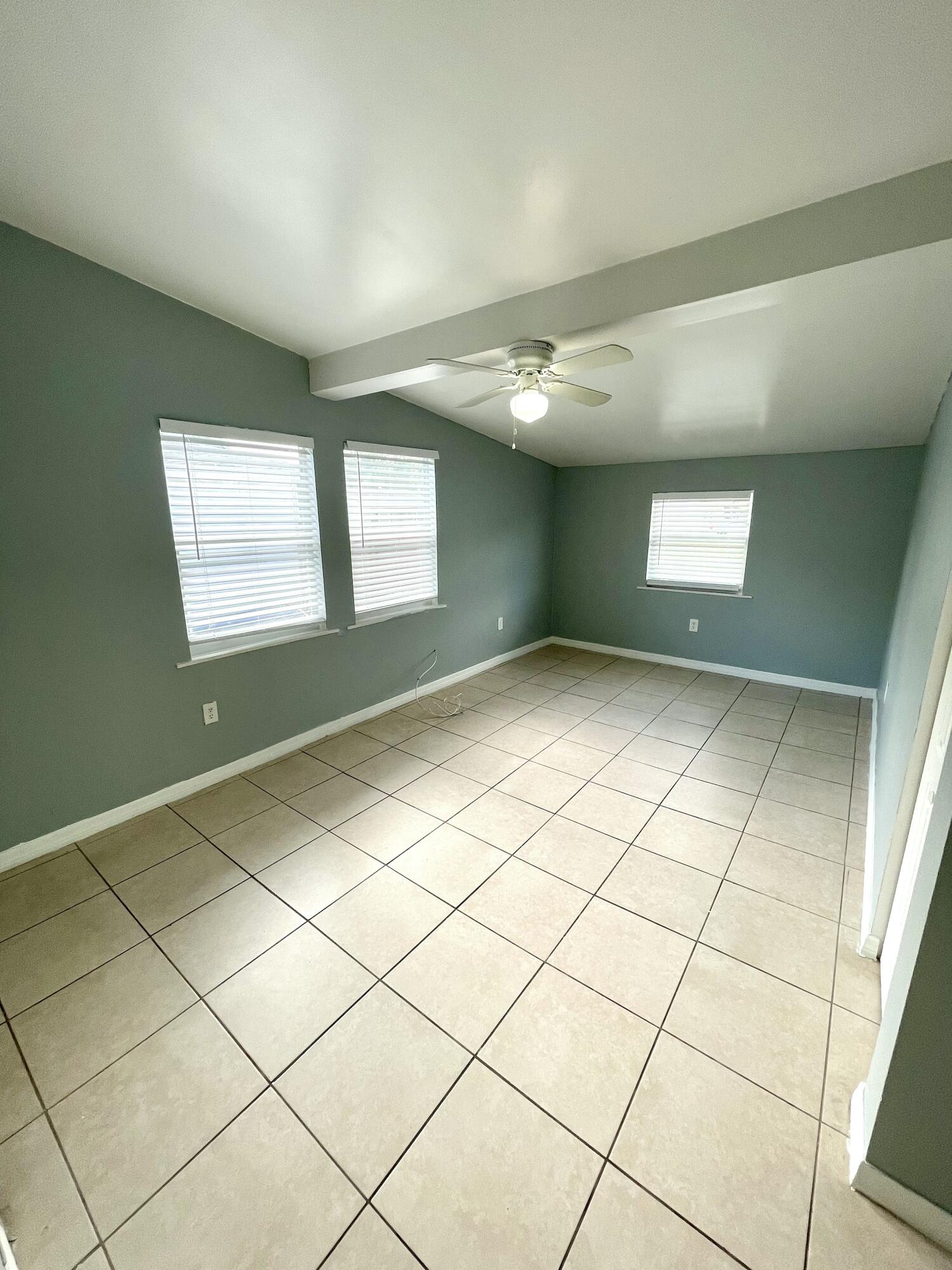 640 54th Street, Unit A West Palm Beach, FL 33407 - Photo 8 of 13 a view of an empty room and window