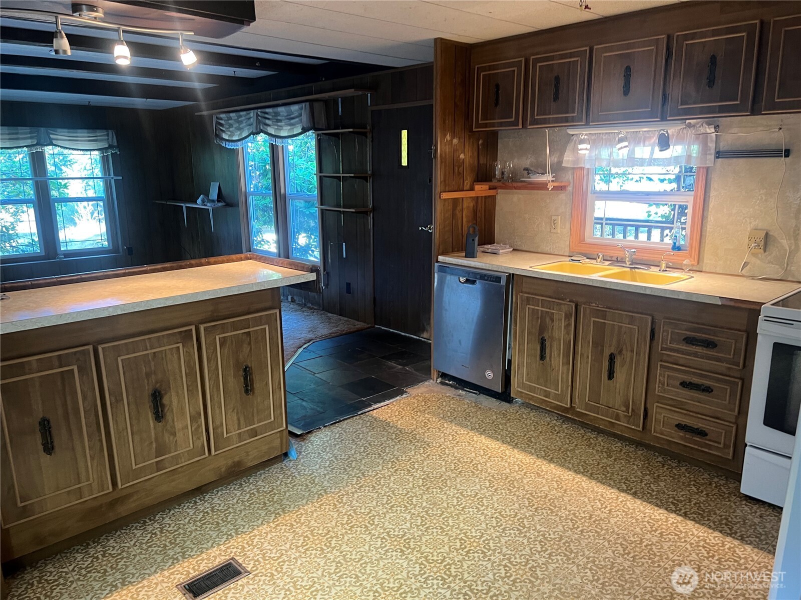 6402 154th Street Northwest, Unit 40 Gig Harbor, WA 98332 - Photo 15 of 23 a kitchen with stainless steel appliances granite countertop a sink and a stove