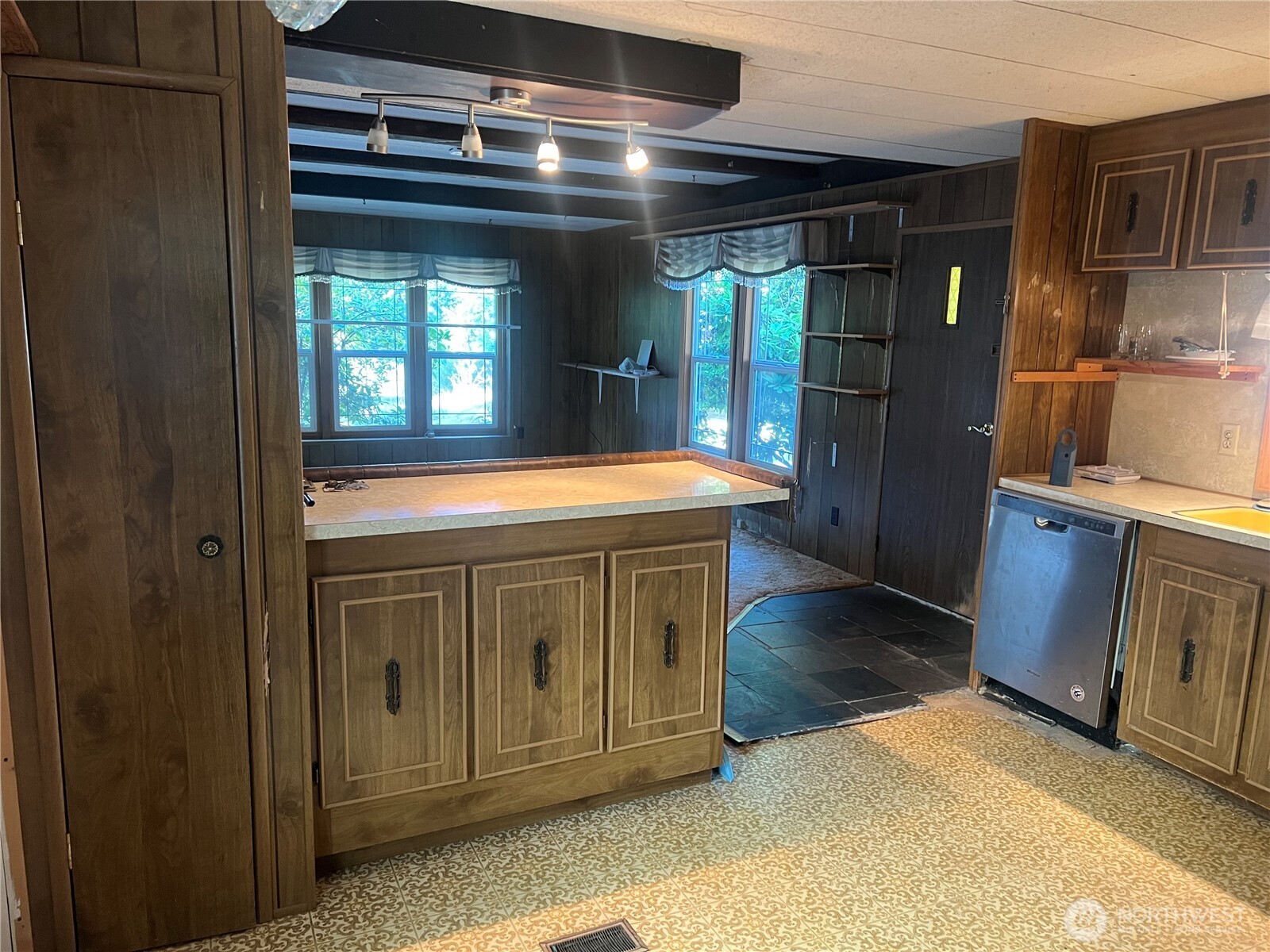 6402 154th Street Northwest, Unit 40 Gig Harbor, WA 98332 - Photo 16 of 23 a kitchen with stainless steel appliances granite countertop a refrigerator and a sink