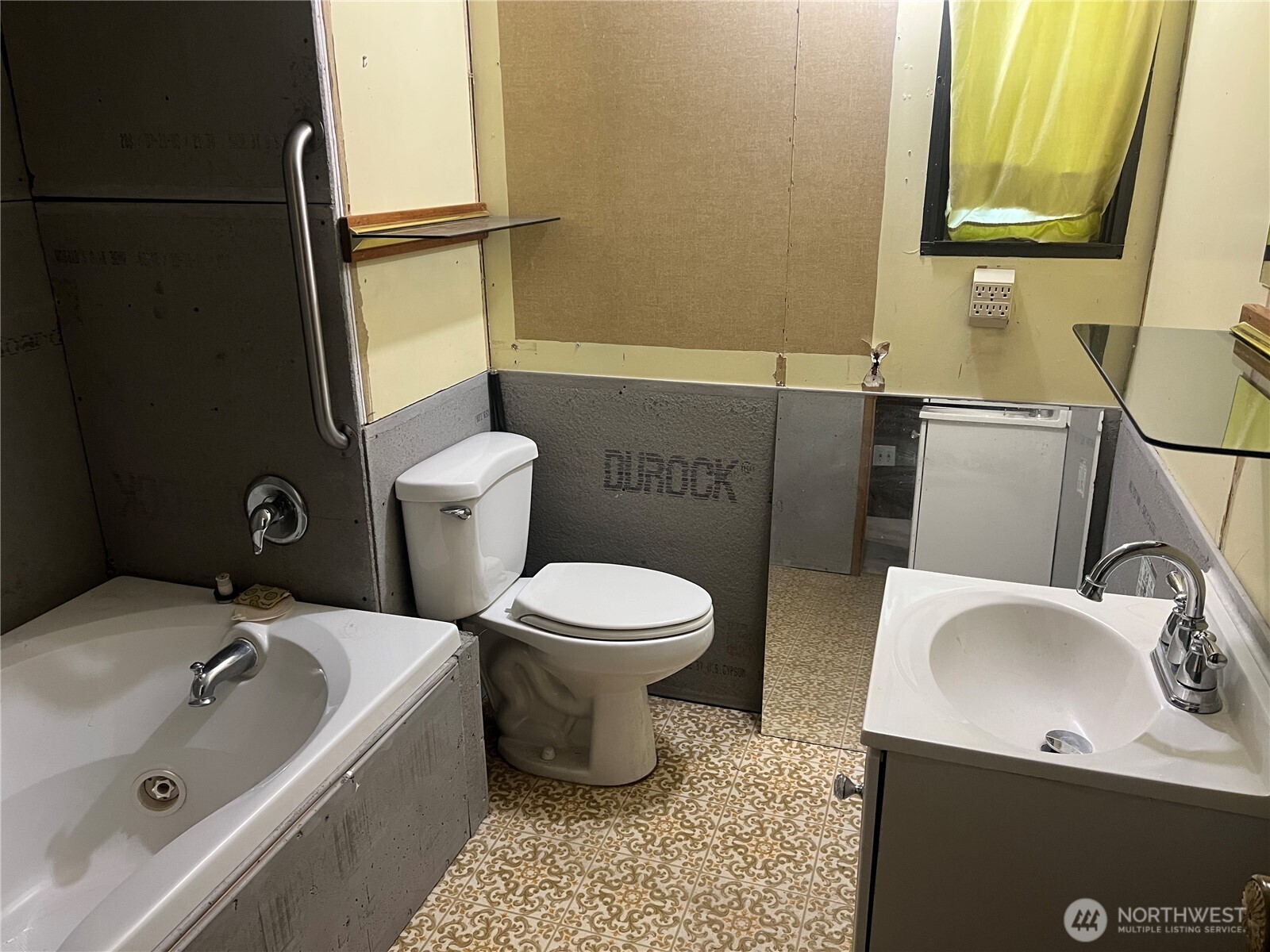 6402 154th Street Northwest, Unit 40 Gig Harbor, WA 98332 - Photo 22 of 23 a bathroom with a sink toilet and shower
