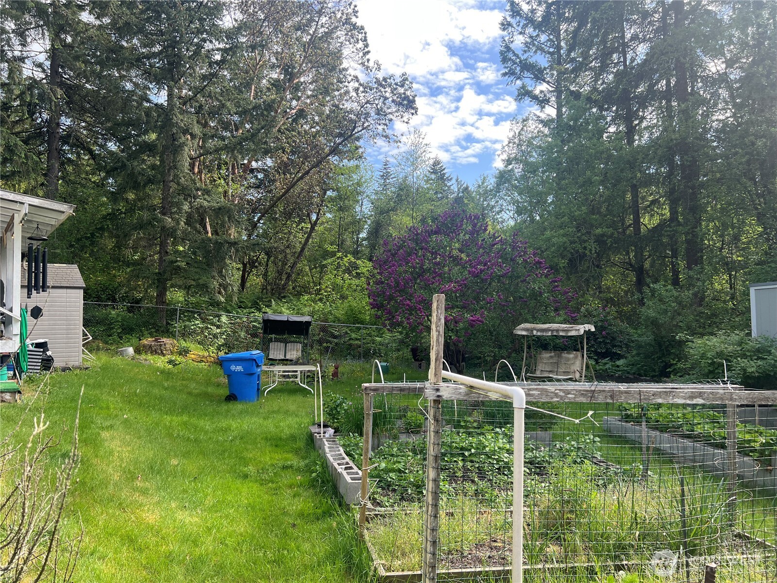 6402 154th Street Northwest, Unit 40 Gig Harbor, WA 98332 - Photo 8 of 23 a view of house with backyard space and lake view