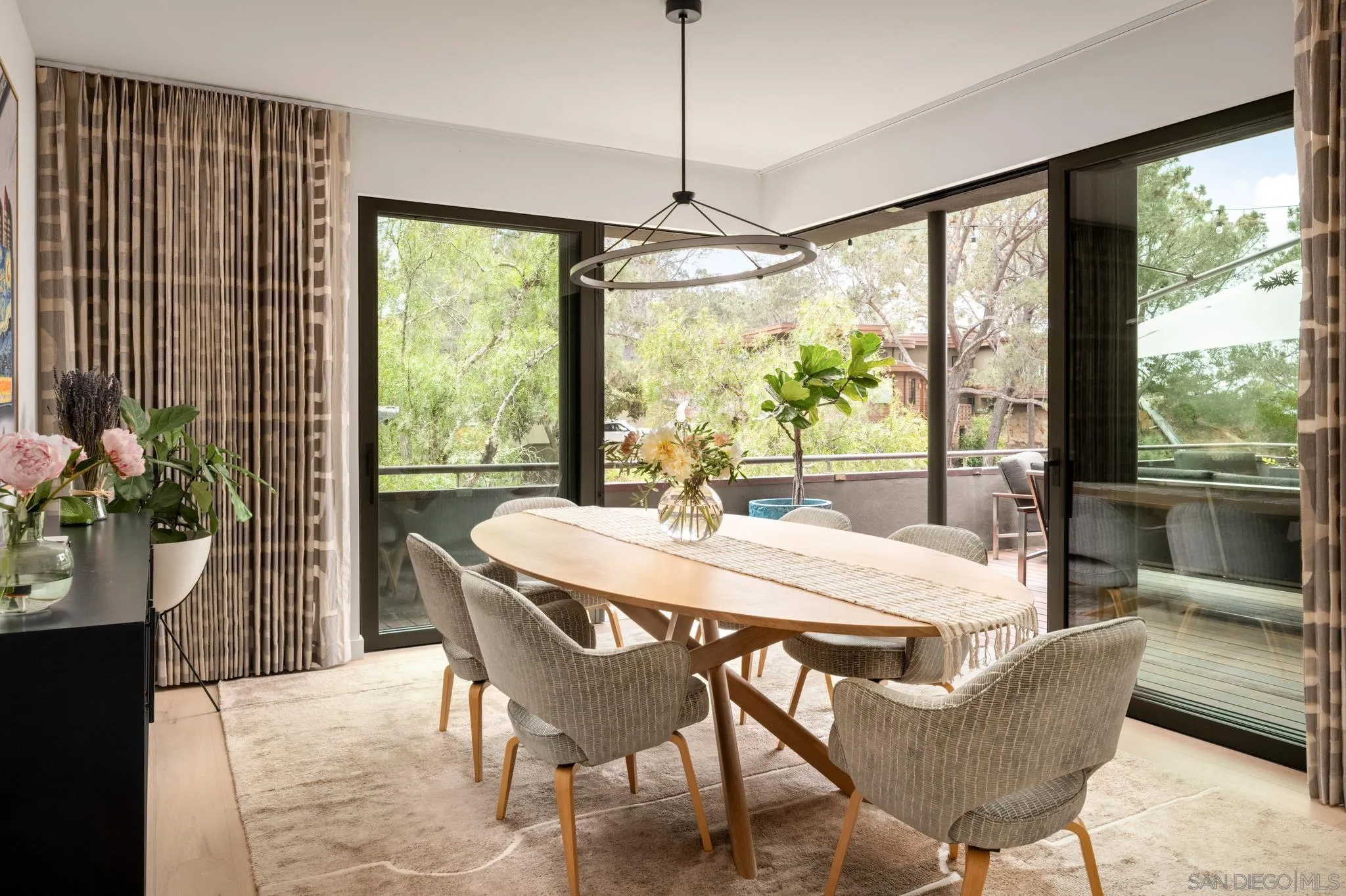 404 Pine Needles Drive Del Mar, CA 92014 - Photo 18 of 71 a dining room with furniture a chandelier and wooden floor