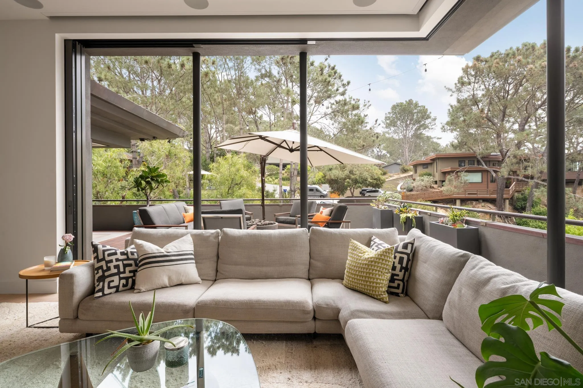 404 Pine Needles Drive Del Mar, CA 92014 - Photo 19 of 71 a living room with furniture and a large window