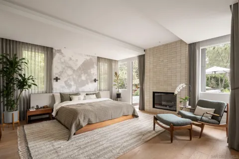 a bedroom with a large bed and a large window