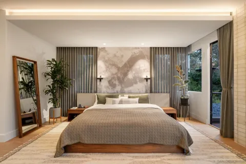 a bedroom with furniture and wooden floor