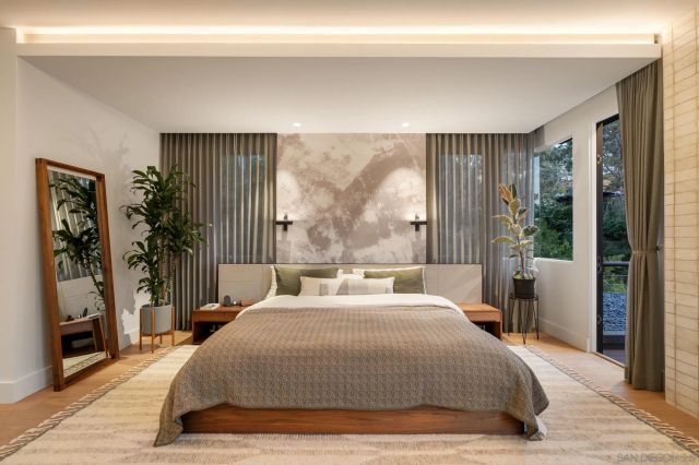 a bedroom with furniture and wooden floor