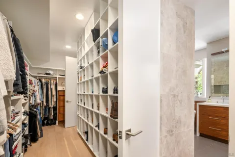 a view of a livingroom with workspace and a window