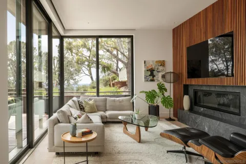 a view of a patio with furniture and backyard