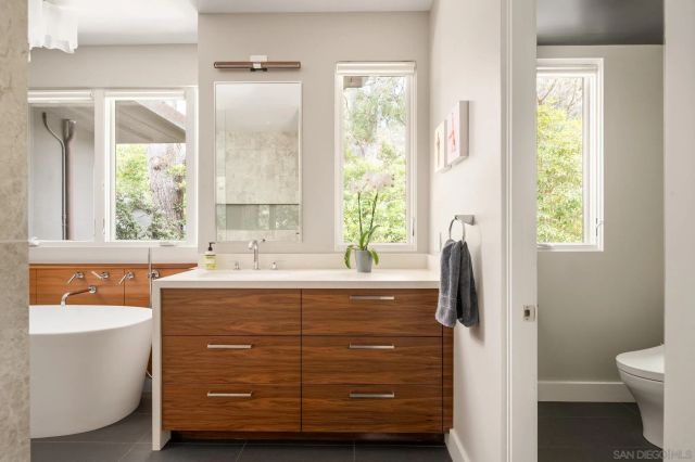 a view of an entryway with wooden floor and windows