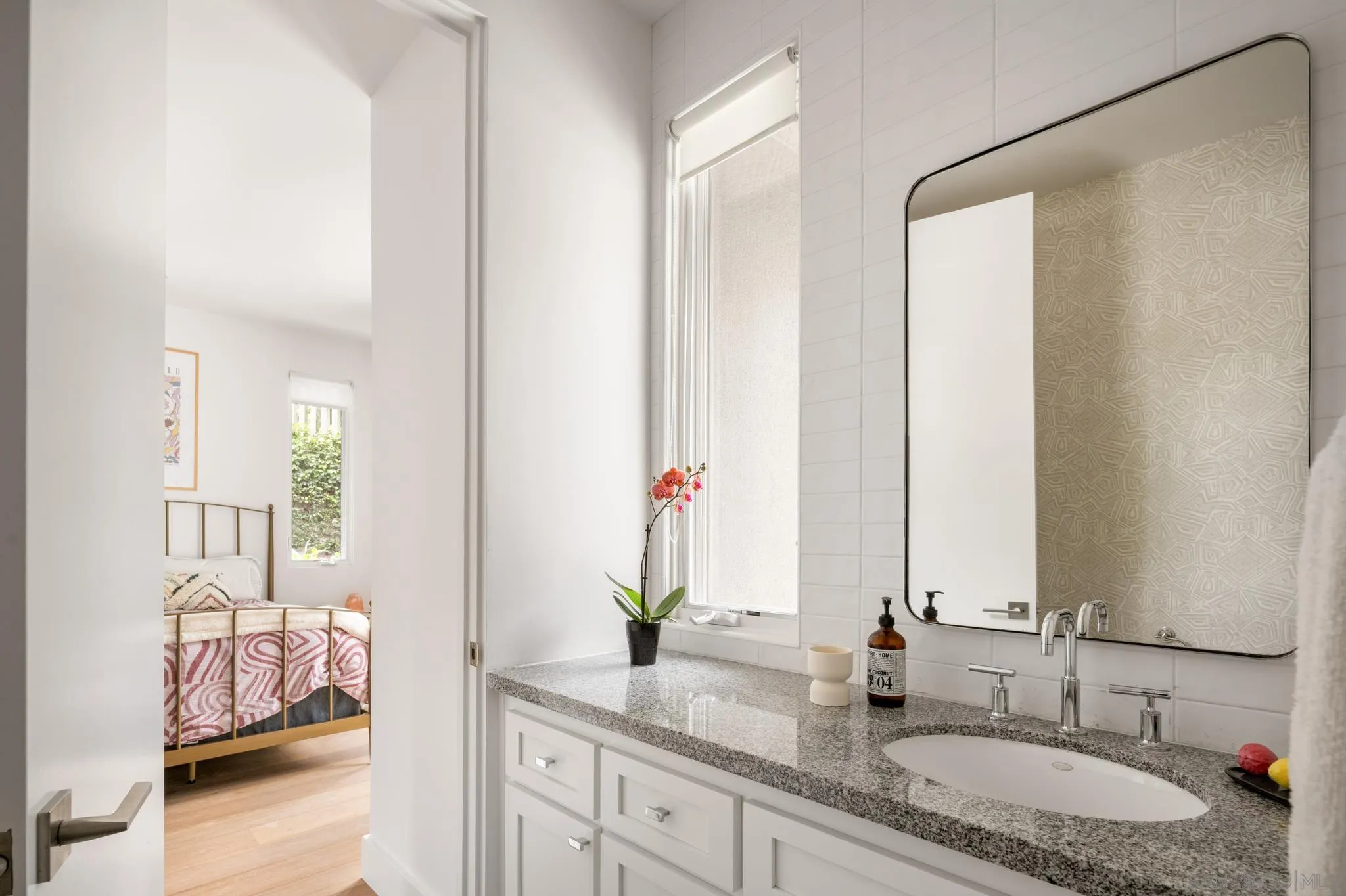 404 Pine Needles Drive Del Mar, CA 92014 - Photo 37 of 71 a bathroom with double vanity and a mirror