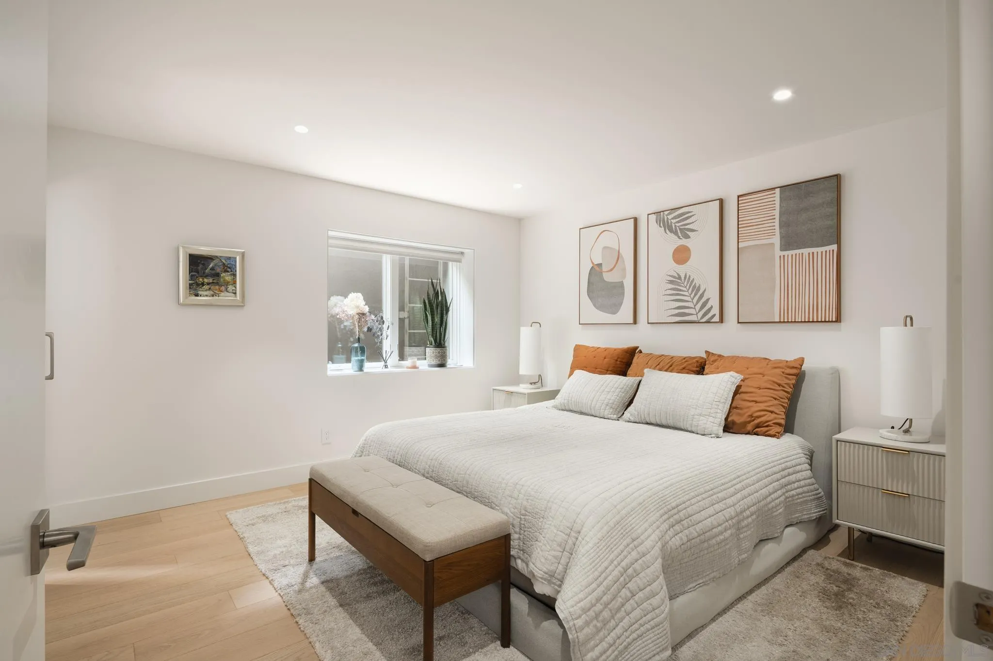 404 Pine Needles Drive Del Mar, CA 92014 - Photo 43 of 71 a bedroom with a bed and a painting on the wall