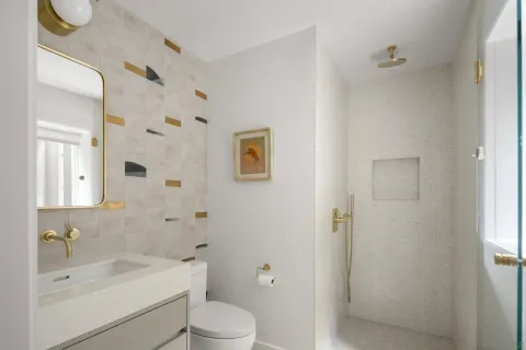 a view of house with a yard and potted plants