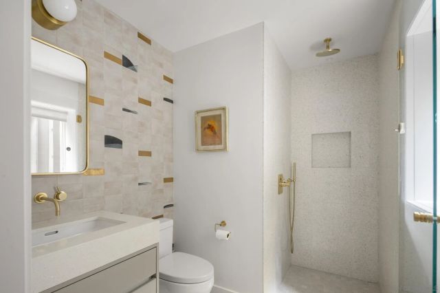 a view of house with a yard and potted plants