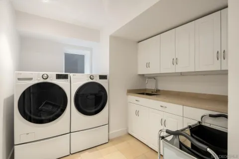 a view of a patio with couches chairs and a potted plant