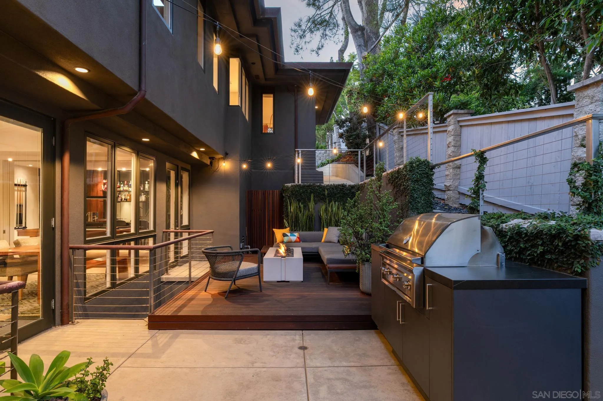 404 Pine Needles Drive Del Mar, CA 92014 - Photo 48 of 71 a view of a patio with couches and table and chairs and potted plants
