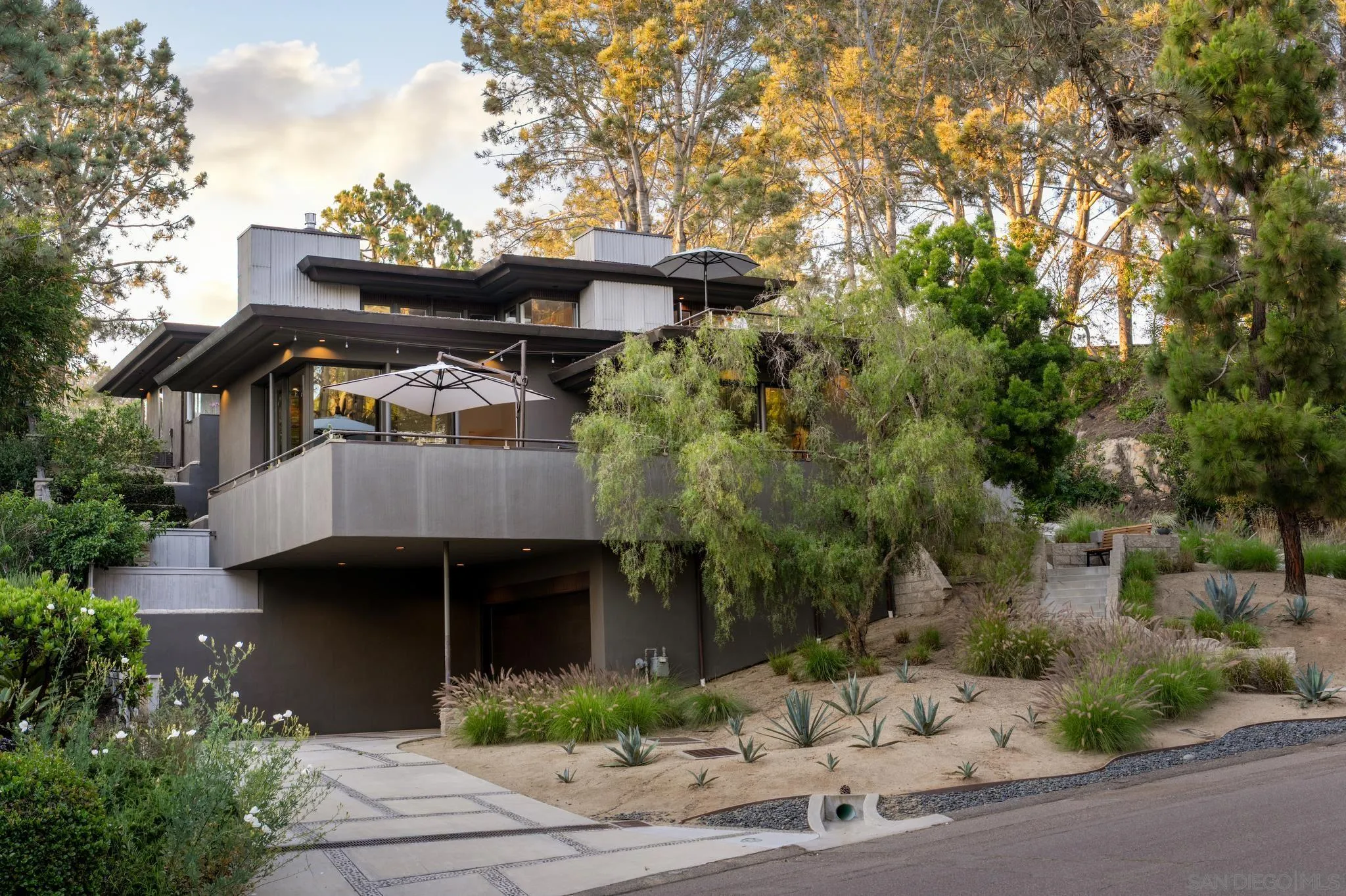 404 Pine Needles Drive Del Mar, CA 92014 - Photo 5 of 71 a front view of a house with a garden
