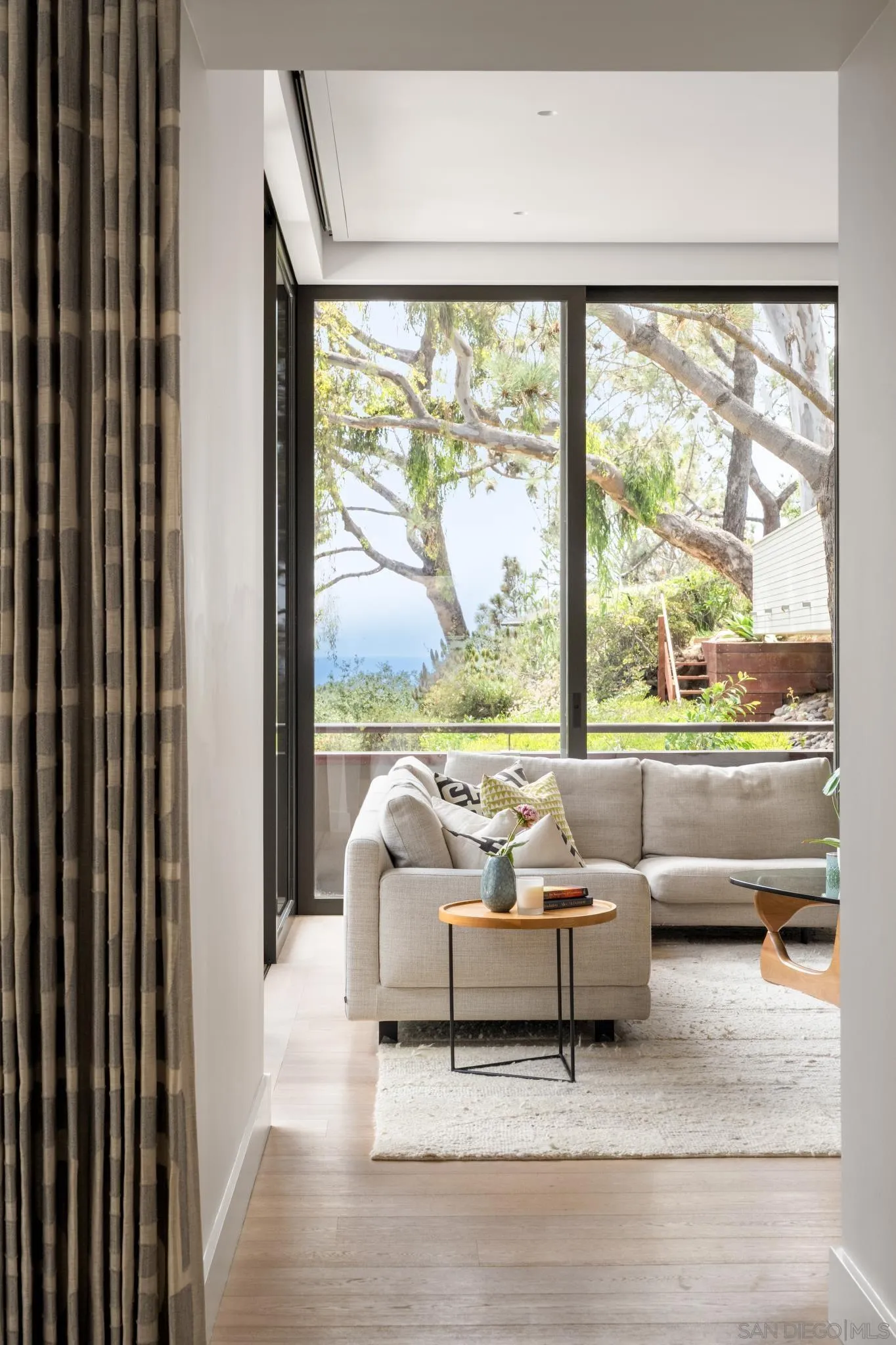 404 Pine Needles Drive Del Mar, CA 92014 - Photo 57 of 71 a living room with furniture and a large window