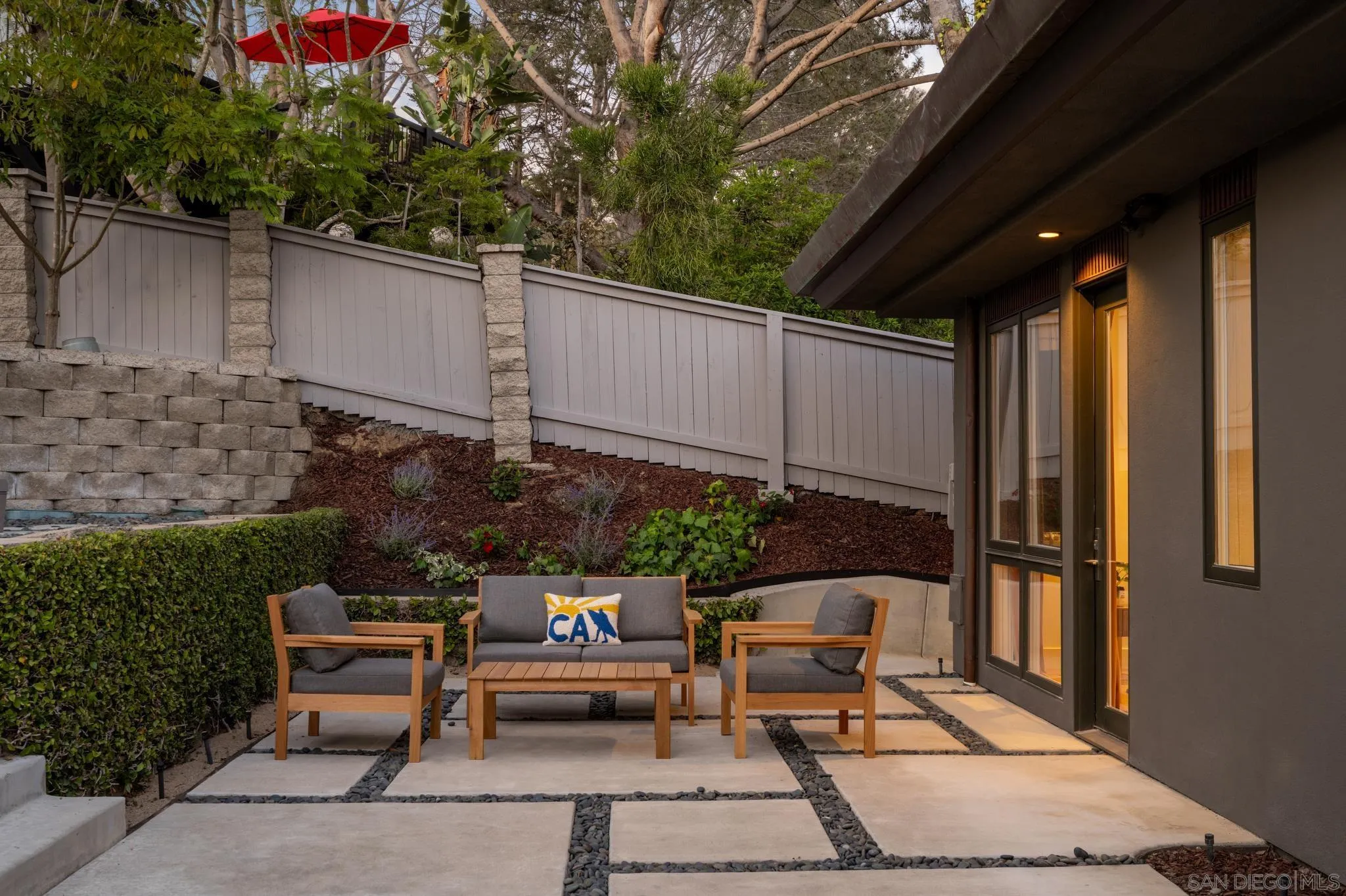 404 Pine Needles Drive Del Mar, CA 92014 - Photo 65 of 71 a backyard of a house with a garden and outdoor seating