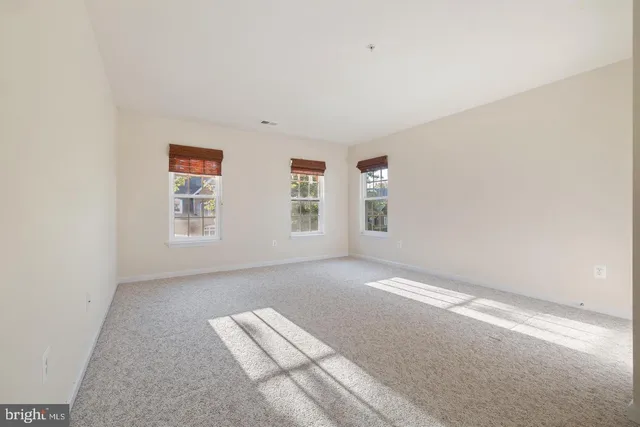 a white toilet sitting next to a bath tub