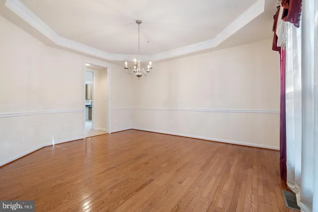 a view of an empty room with a fireplace