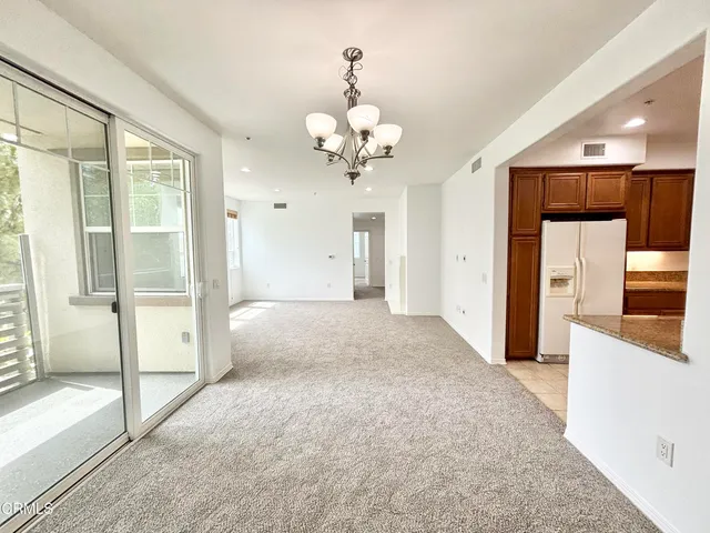 a view of an entryway of a house and chandelier