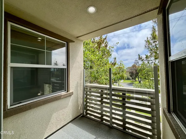 a view of a balcony with front door