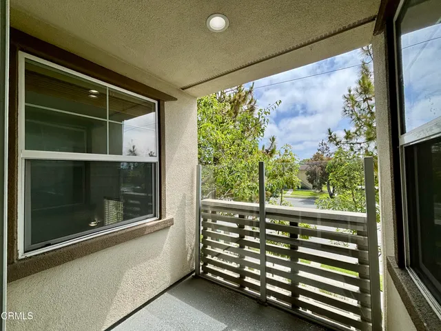 a view of a balcony with front door