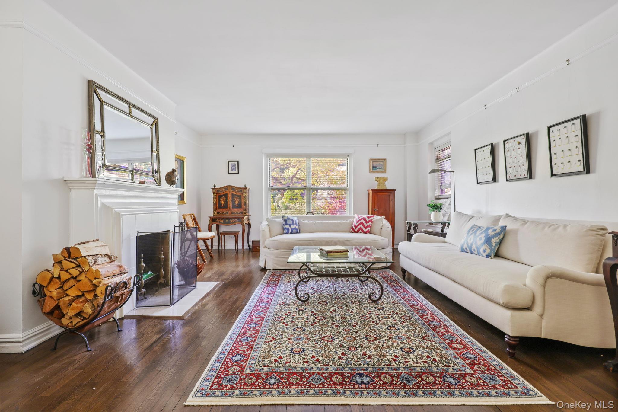 250 Bronxville Road, Unit 2G Bronxville, NY 10708 - Photo 3 of 14 a living room with furniture and a fireplace