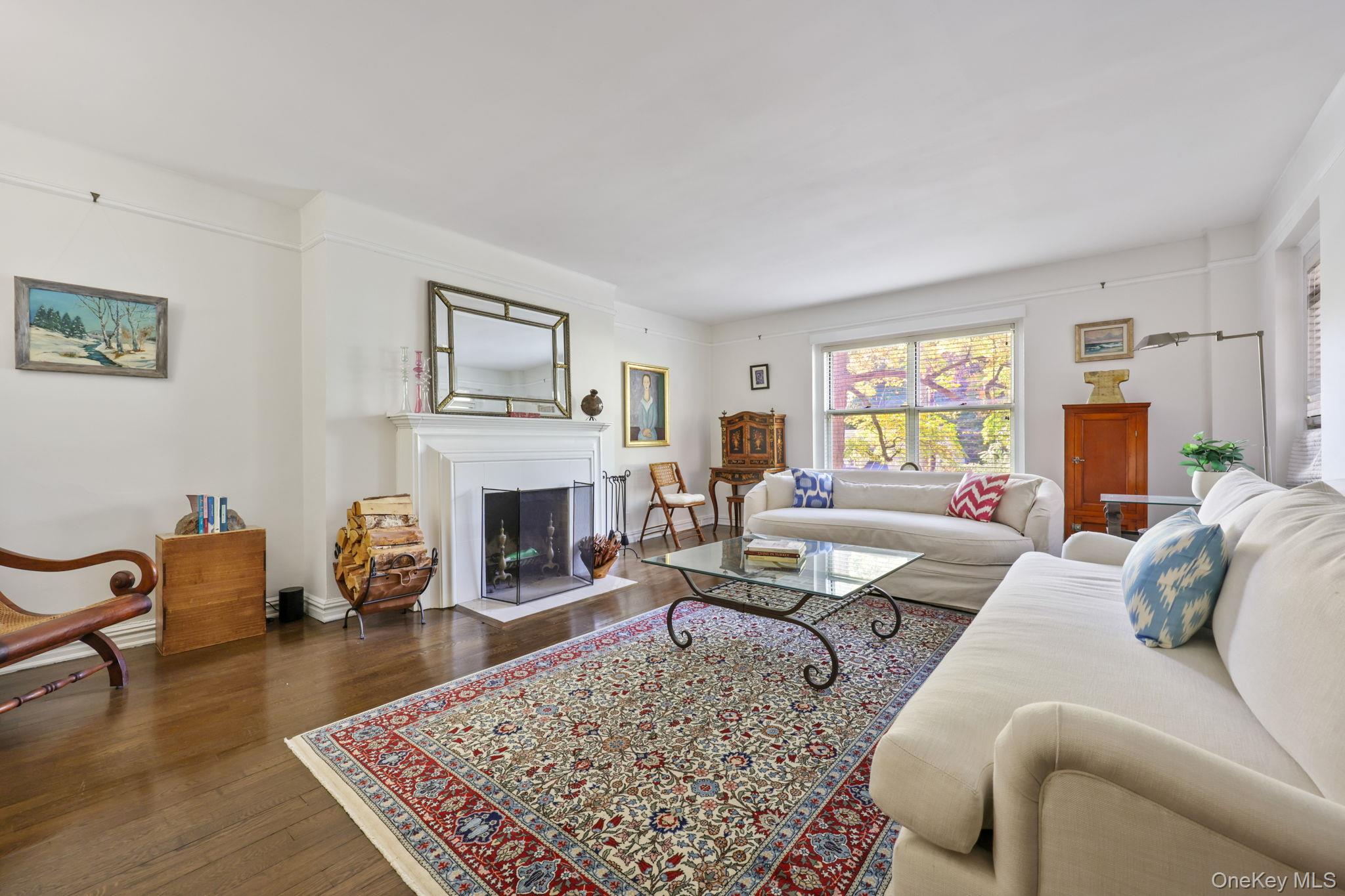 250 Bronxville Road, Unit 2G Bronxville, NY 10708 - Photo 5 of 14 a living room with furniture fireplace and window