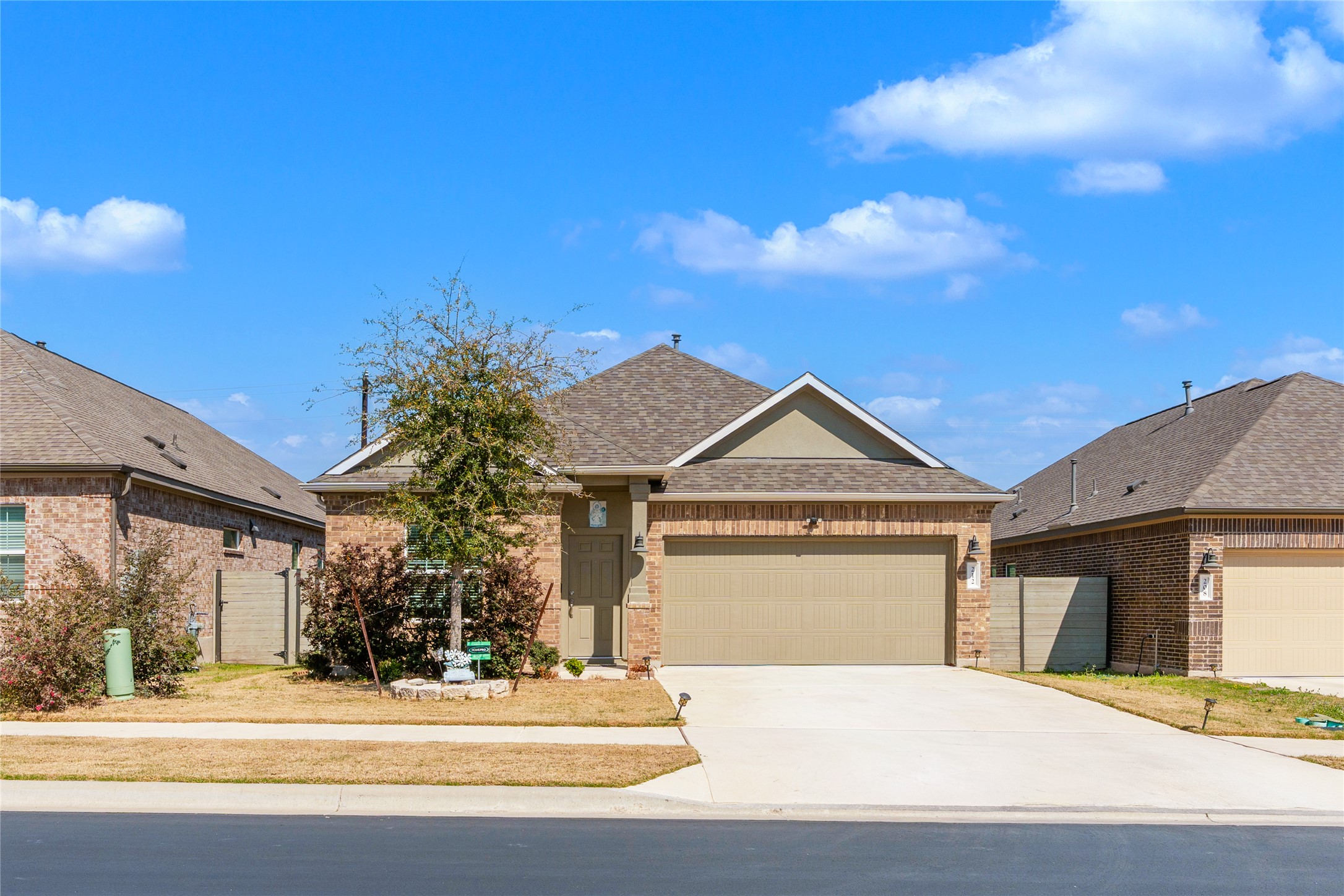 212 Saddle Mountain Road Georgetown, TX 78628 - Photo 1 of 38 a front view of a house with a yard