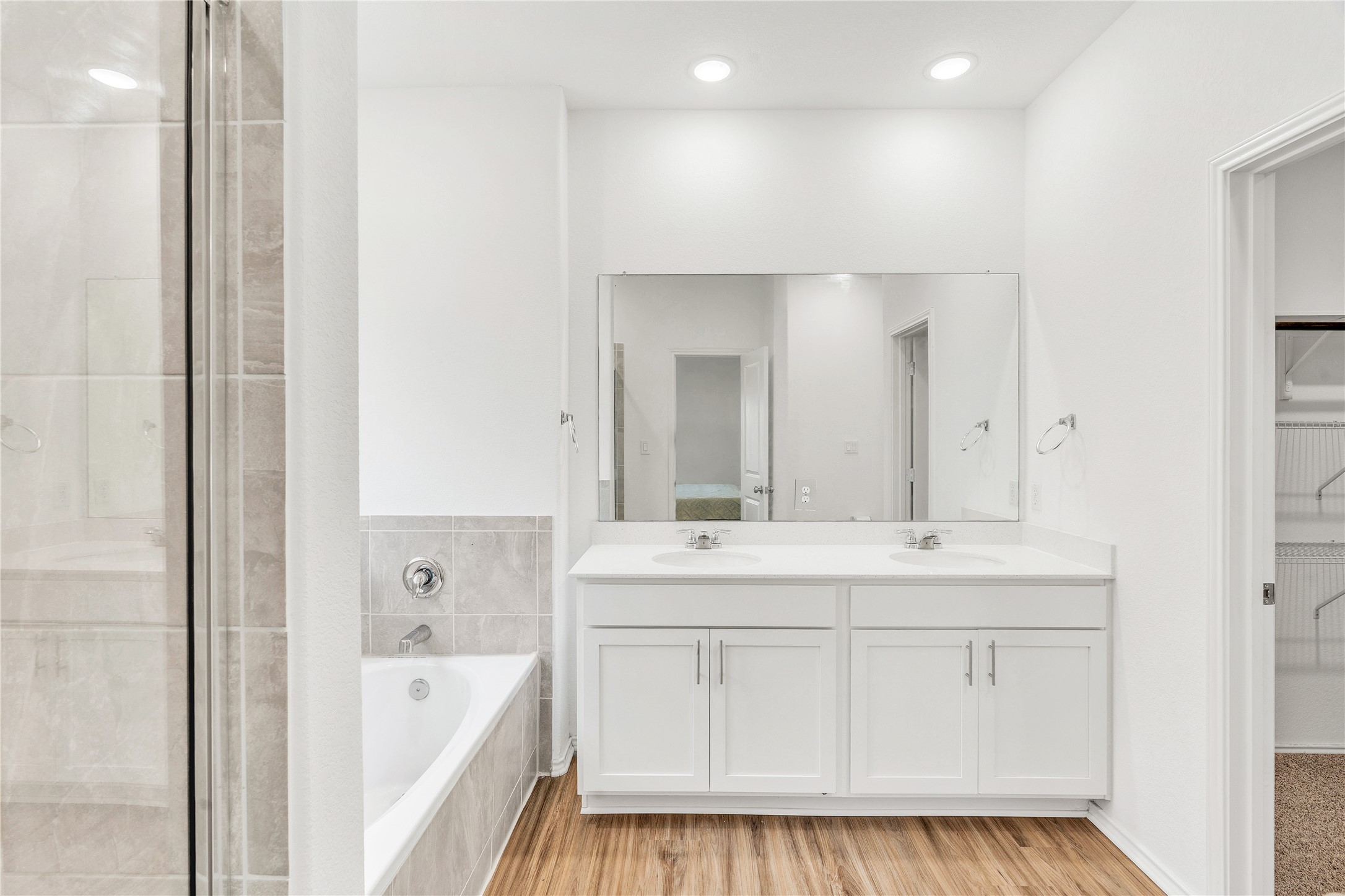 212 Saddle Mountain Road Georgetown, TX 78628 - Photo 13 of 38 a spacious bathroom with a tub sink and mirror