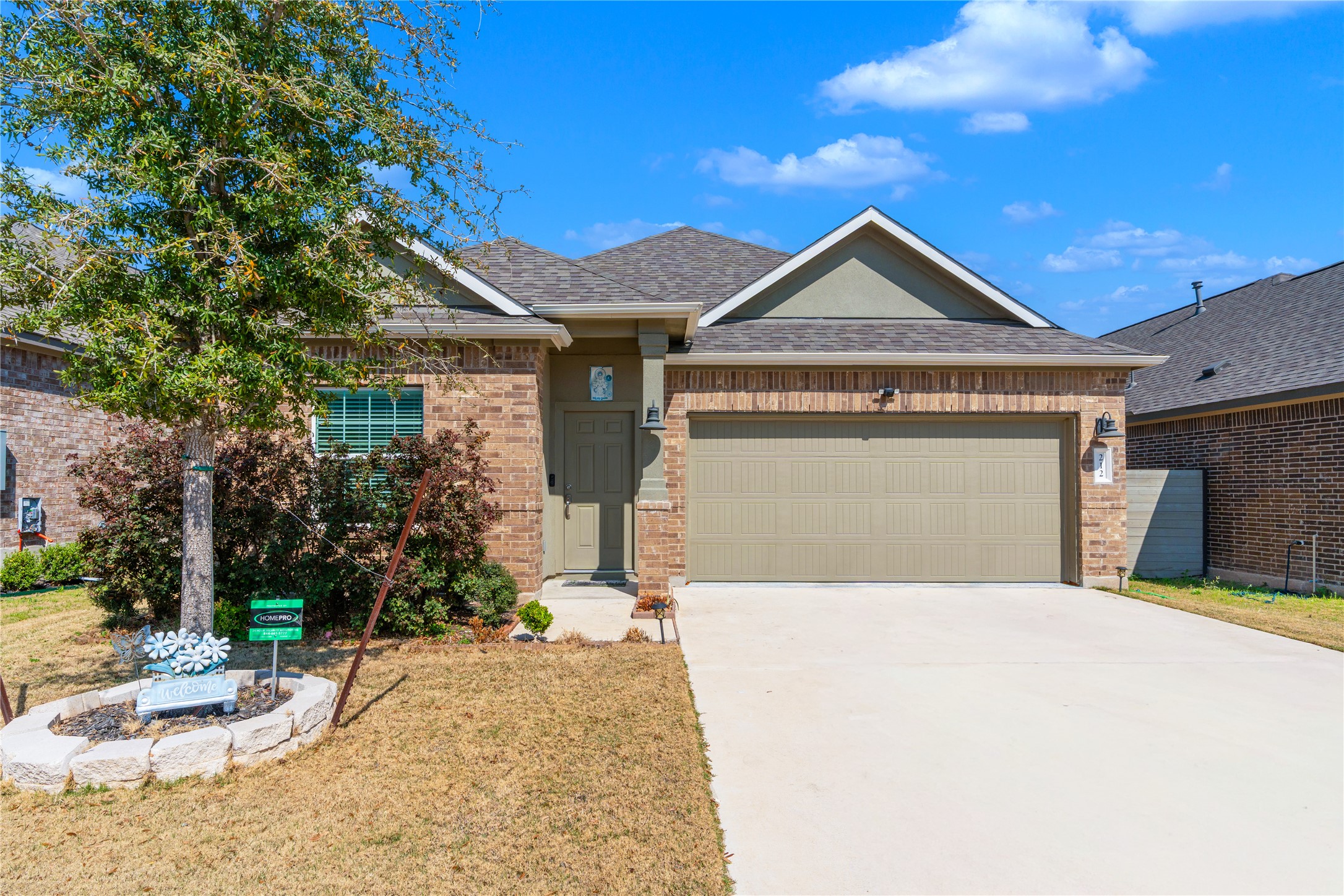 212 Saddle Mountain Road Georgetown, TX 78628 - Photo 2 of 38 a view of a house with a yard and potted plants