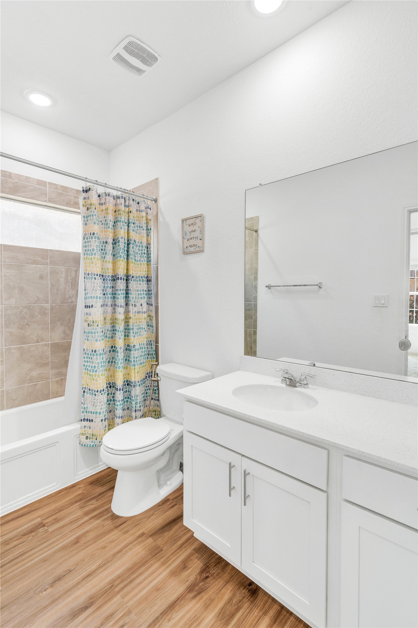 212 Saddle Mountain Road Georgetown, TX 78628 - Photo 25 of 38 a spacious bathroom with a granite countertop sink toilet a mirror and shower