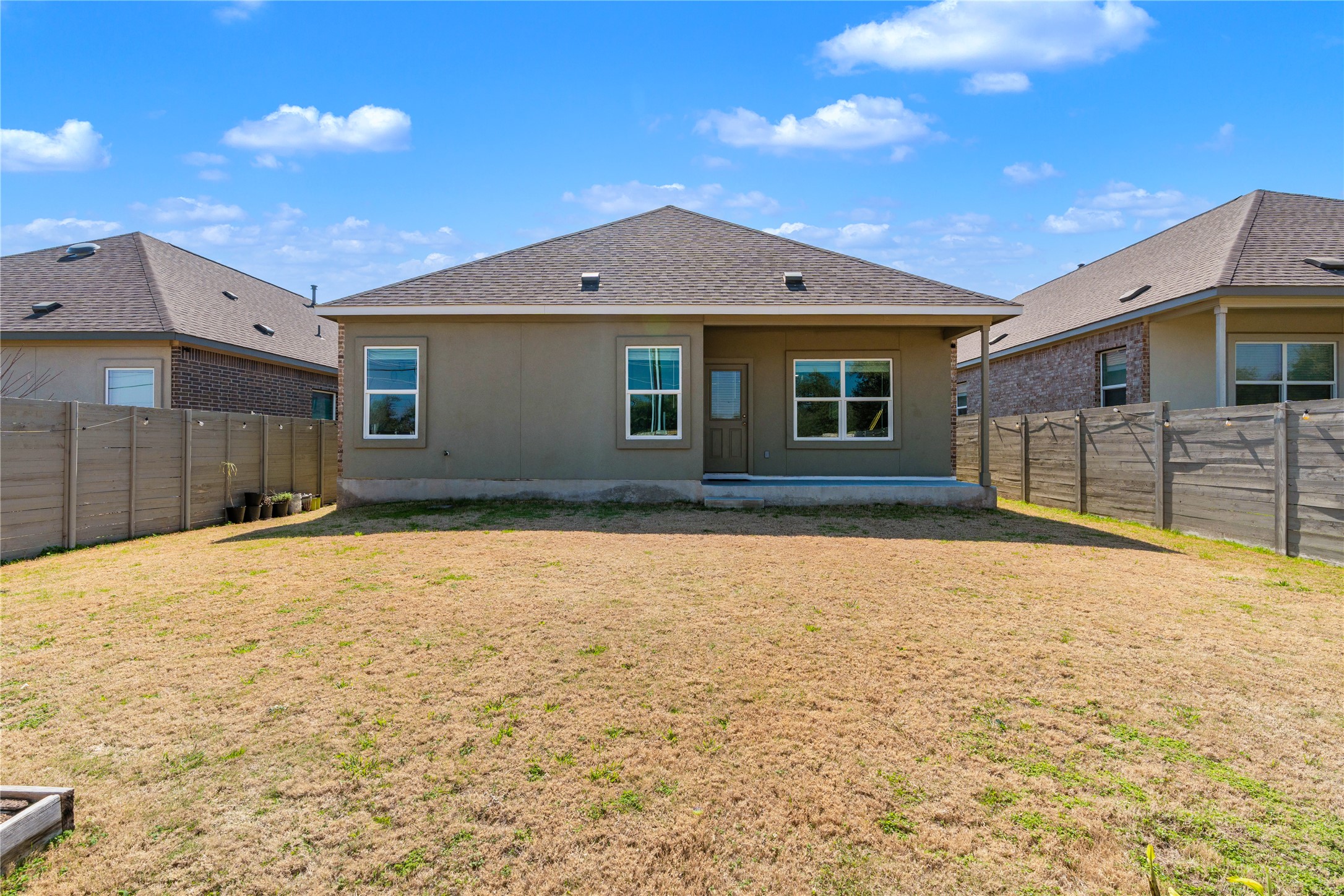 212 Saddle Mountain Road Georgetown, TX 78628 - Photo 26 of 38 a front view of a house with a yard
