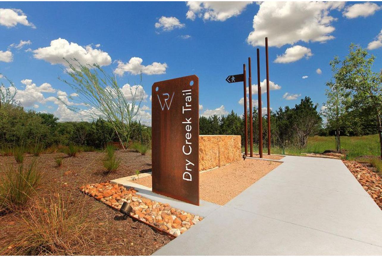 212 Saddle Mountain Road Georgetown, TX 78628 - Photo 37 of 38 a sign board with a lake view