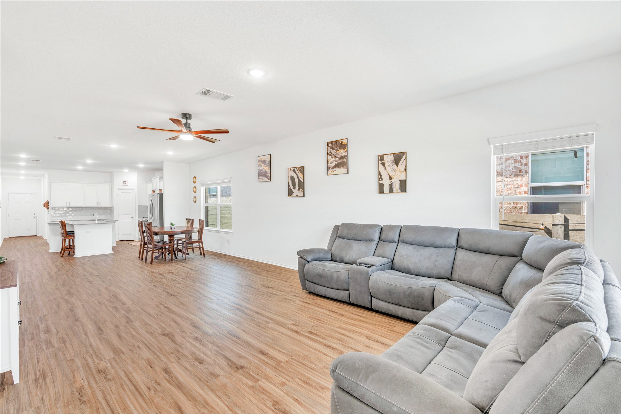 212 Saddle Mountain Road Georgetown, TX 78628 - Photo 4 of 38 a living room with furniture and a wooden floor