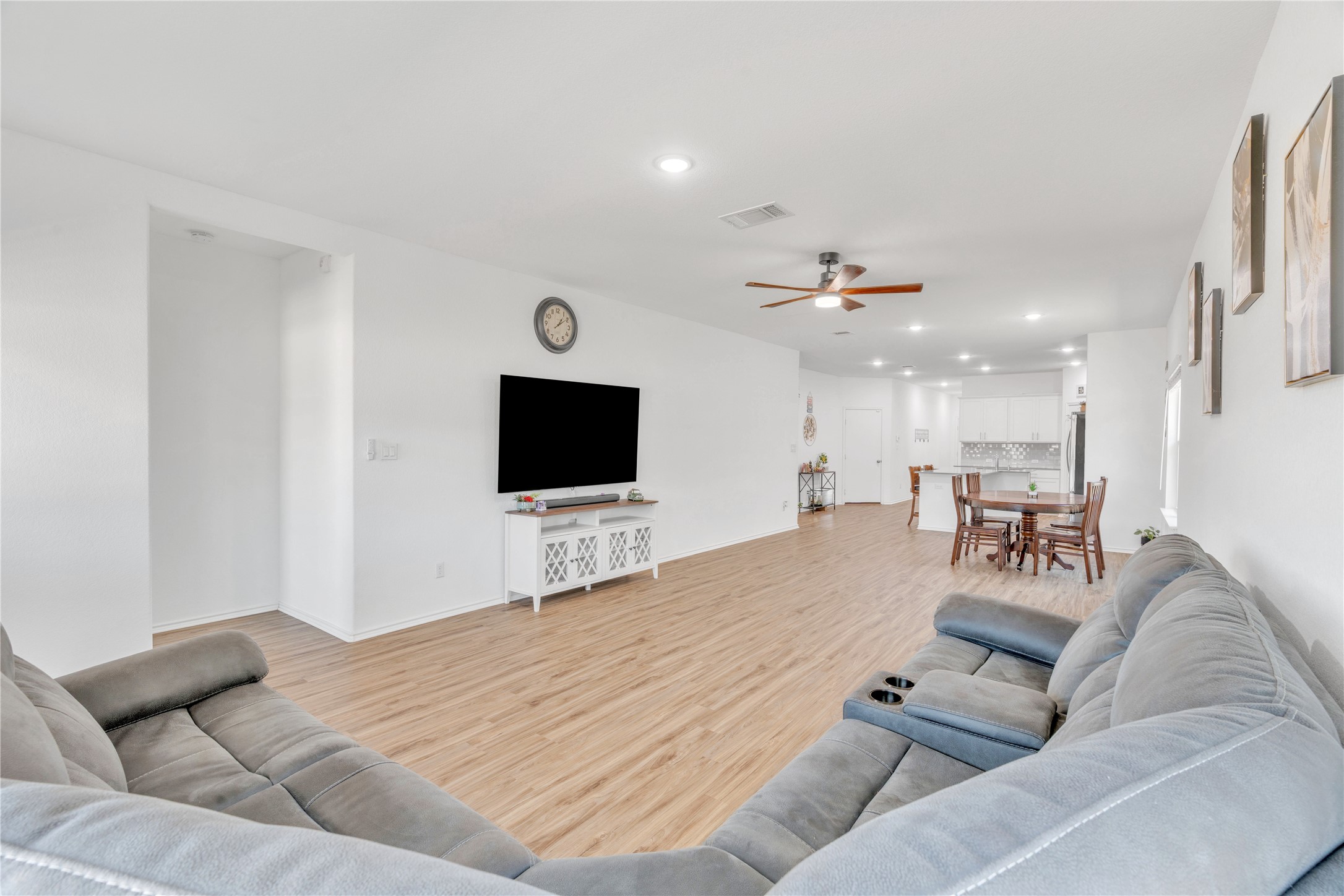 212 Saddle Mountain Road Georgetown, TX 78628 - Photo 5 of 38 a living room with furniture and a flat screen tv
