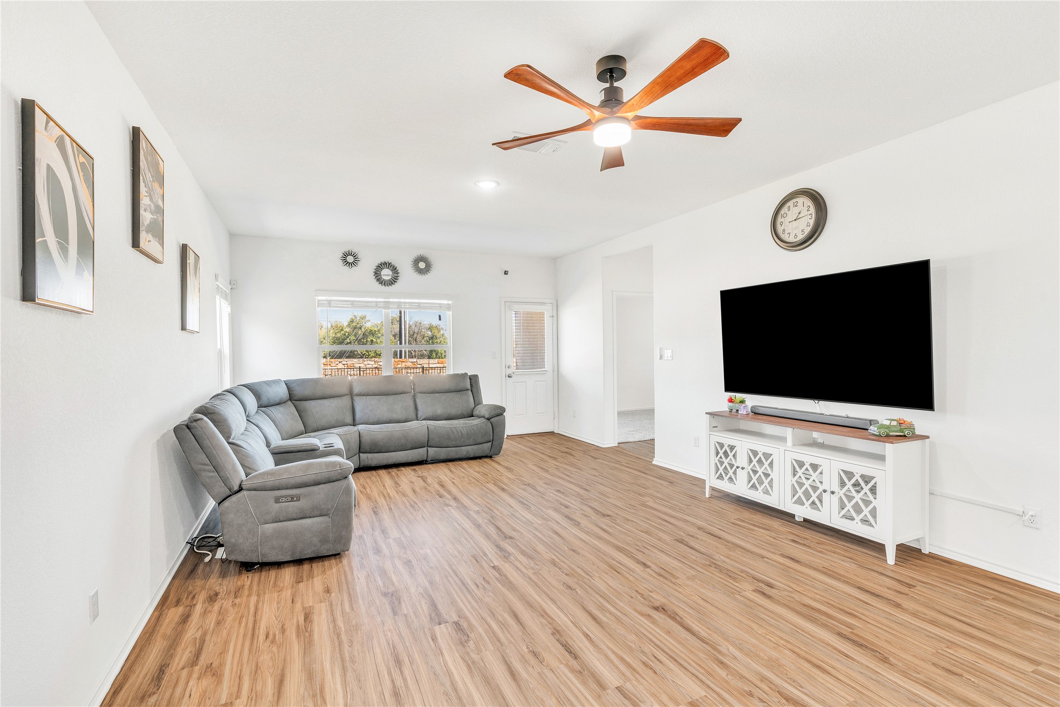 212 Saddle Mountain Road Georgetown, TX 78628 - Photo 7 of 38 a living room with furniture and a flat screen tv