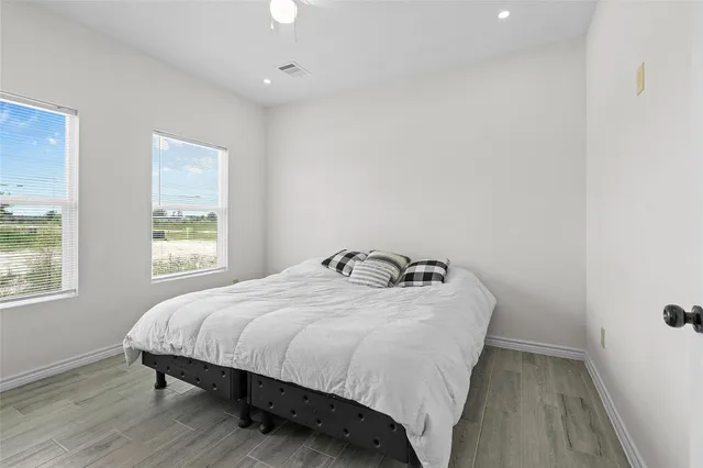 a bedroom with a bed and window