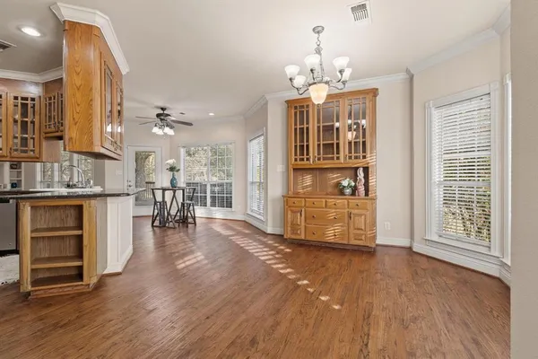 a kitchen with stainless steel appliances granite countertop a stove and a refrigerator