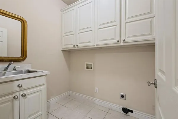 a bathroom with a bathtub sink and mirror