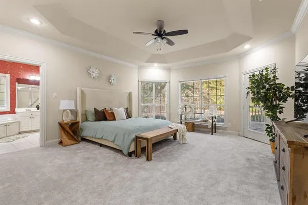 a bathroom with a bathtub sink and mirror
