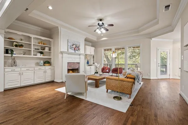 a kitchen with stainless steel appliances granite countertop a refrigerator a stove and a wooden floors