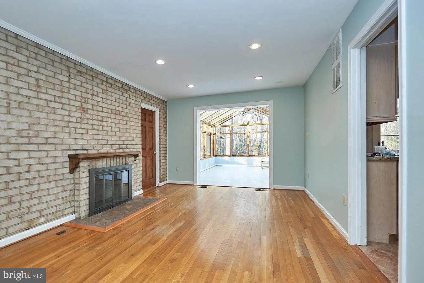 11312 Myrtle Lane Reston, VA 20191 - Photo 13 of 24 a view of an empty room with a fireplace and a window