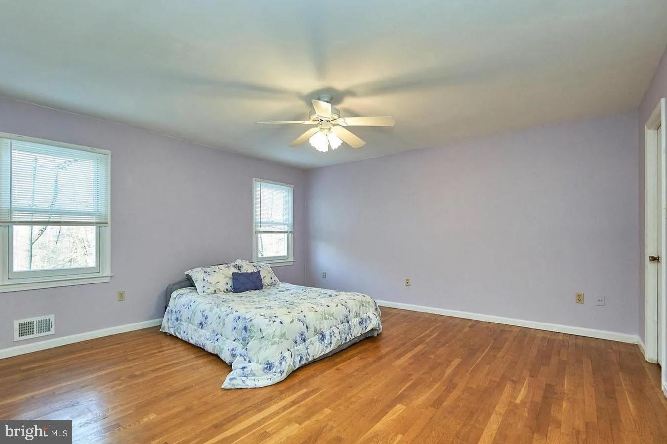 11312 Myrtle Lane Reston, VA 20191 - Photo 16 of 24 a bedroom with a bed and a window