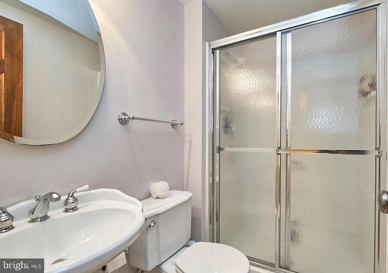 11312 Myrtle Lane Reston, VA 20191 - Photo 23 of 24 a bathroom with a sink toilet and shower