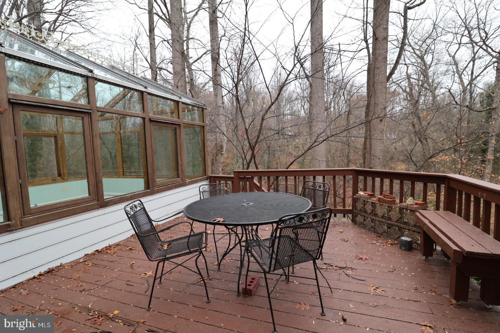 11312 Myrtle Lane Reston, VA 20191 - Photo 5 of 24 a view of a chairs and table on the deck