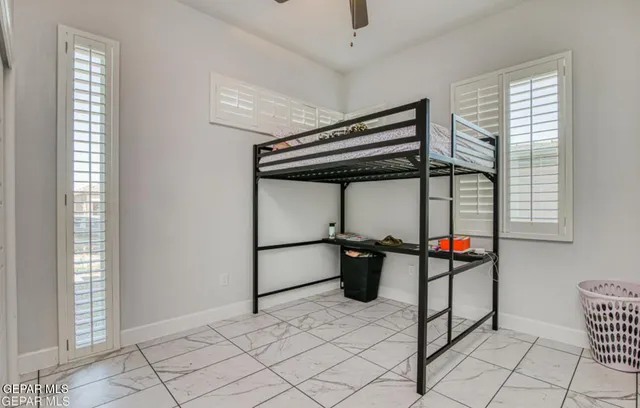 a dinning room with chairs and window